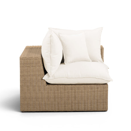 Back profile of brown woven wicker frame on Cali outdoor corner chair