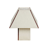 Front angle view of FOAK Josephine geometric pyramid table lamp illuminating living room