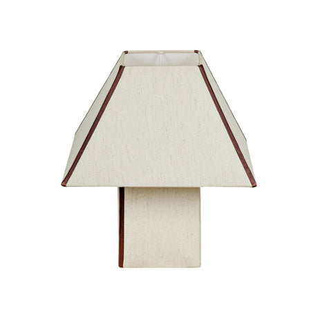 Front angle view of FOAK Josephine geometric pyramid table lamp illuminating living room