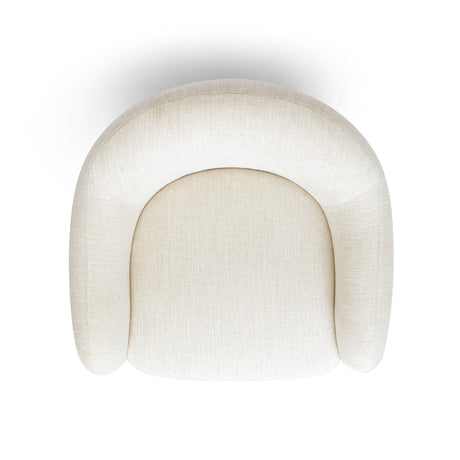 FOAK Salma swivel armchair placed in a cozy bedroom reading corner