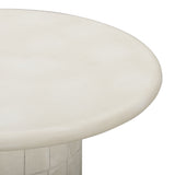 Fafo sculptural concrete side table arranged beside contemporary living room sofa