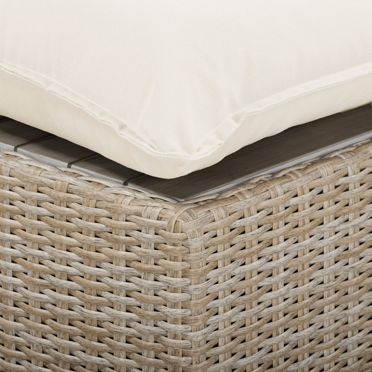 High-angle view of Cali Outdoor Ottoman displayed on an exterior veranda