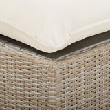 High-angle view of Cali Outdoor Ottoman displayed on an exterior veranda
