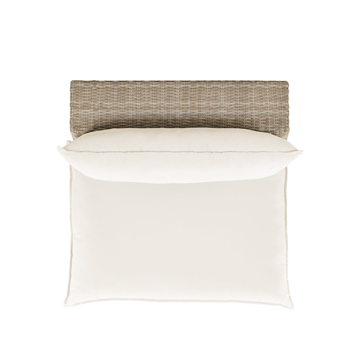 Cali wicker armless chair styled on an outdoor patio terrace with garden background