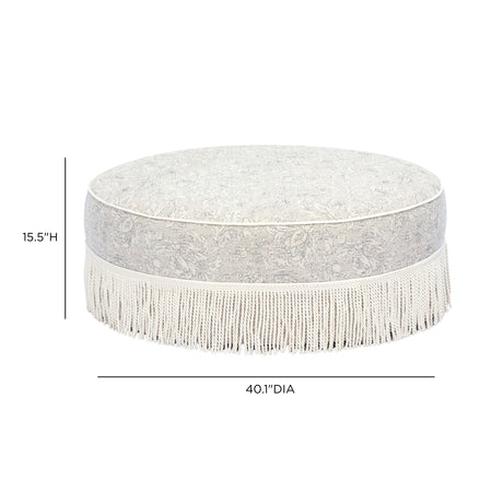 Overhead angled view of Tassy Tasseled Round Ottoman showing firm cushioned seat