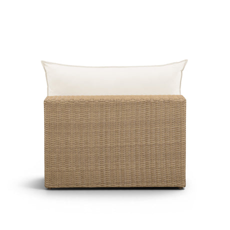 Three-quarter angle of the brown wicker Cali outdoor modular chair with cream cushioning