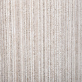 Lilou Cream Striped Jacquard Storage Accent Stool styled in a modern living room setting