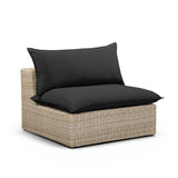 Detailed texture of natural all-weather resin wicker weave on the Cali armless chair base