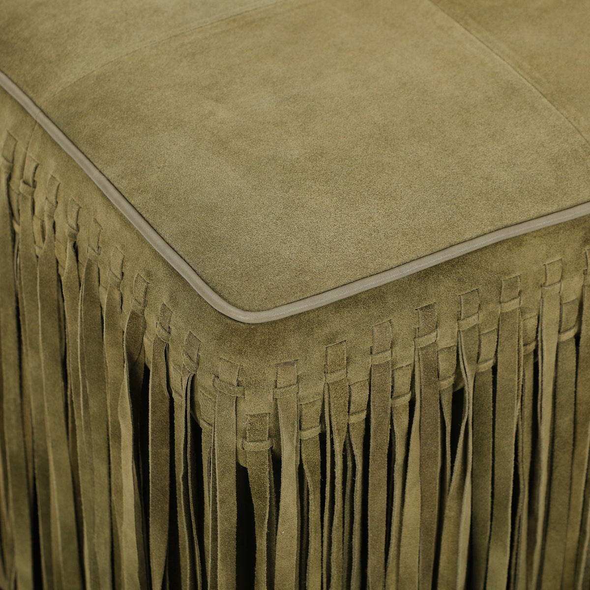 FOAK Daphne fringe ottoman used as a comfortable living room footstool