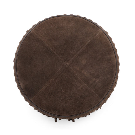 Cognac suede round ottoman showing base construction and fringe fall