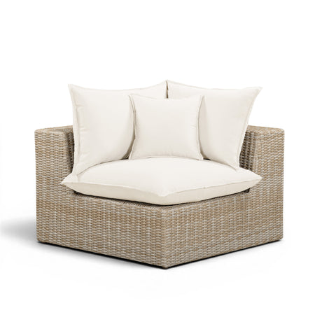 Cali wicker corner chair positioned as an individual outdoor accent seat
