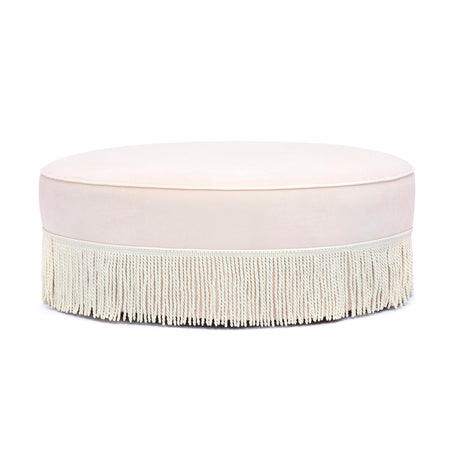 Tassy Tasseled Round Ottoman in pink velvet angled perspective highlighting contrast piping