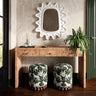 Dex low profile round ottoman on natural wood flooring