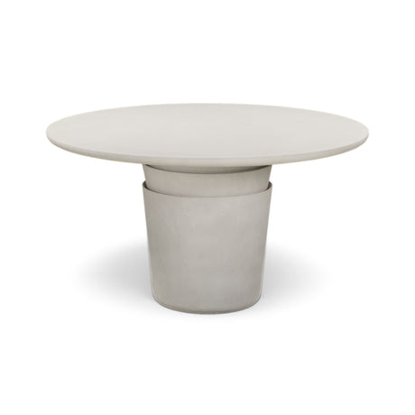 Side profile of Margot indoor outdoor round dining table showcasing organic Wabi Sabi silhouette
