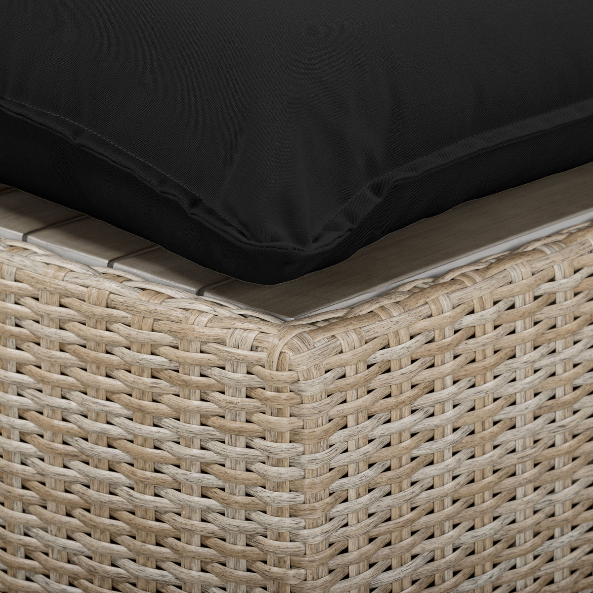 Side profile of Black and Natural Wicker Cali Outdoor Ottoman