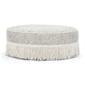 Neutral floral Tassy Round Ottoman arranged as dressing vanity stool seating