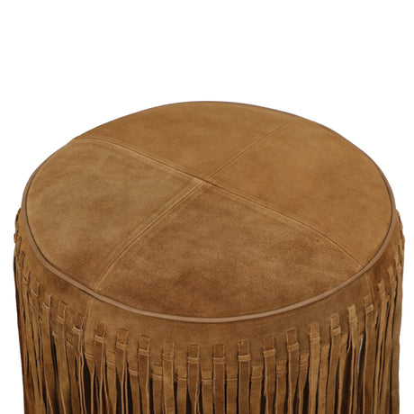 Cognac suede circular ottoman styled in a contemporary living room