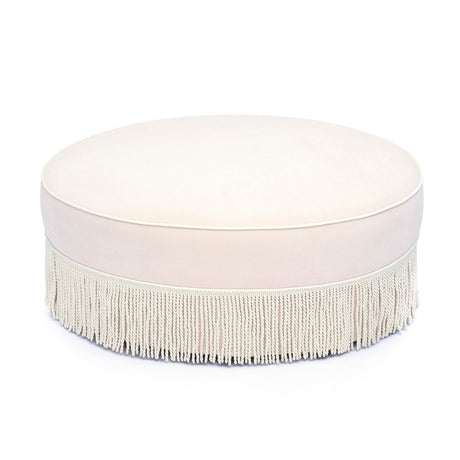 Tassy Tasseled Round Ottoman in pink velvet front view showing tassel fringe trim