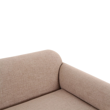 Gorge tan modular loveseat styled in a contemporary neutral lounge living space