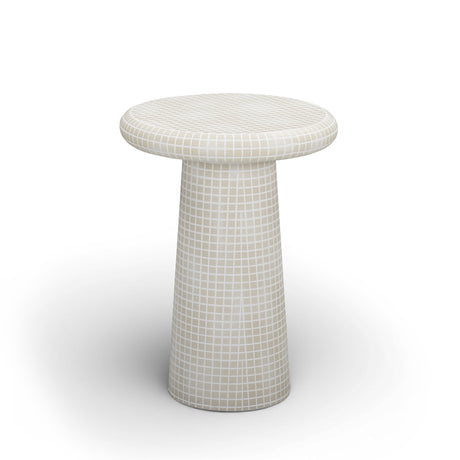 Monica sculptural tiled side table styled beside a modern lounge chair