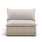 Cali wicker patio armless chair with grey cushions shown at a three-quarter angle