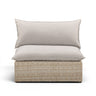 Cali wicker patio armless chair with grey cushions shown at a three-quarter angle