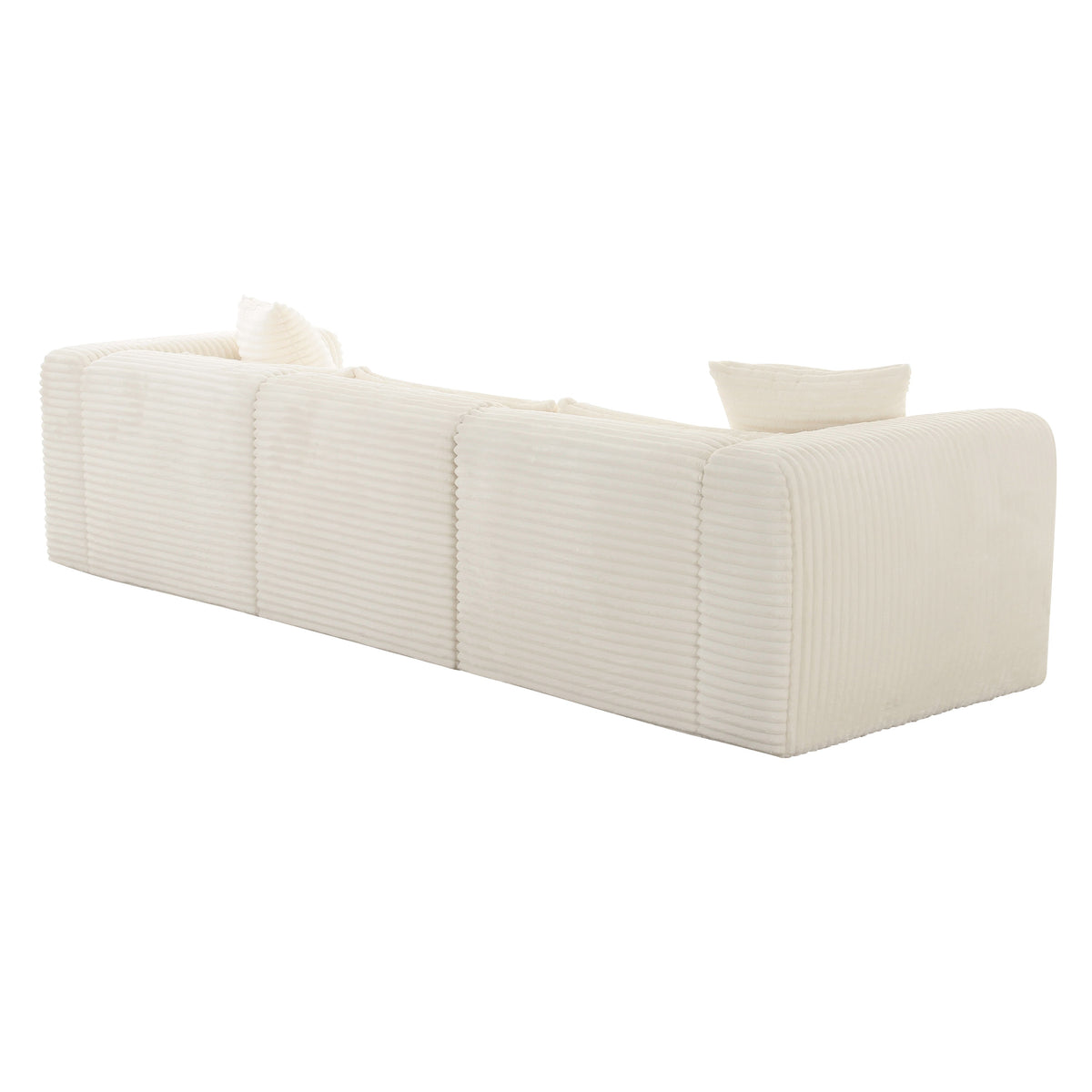 Tarra 118-Inch Modular Sofa in styled contemporary lounge setting with neutral accents