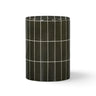 Tatiana concrete side table styled with a beverage glass outdoors