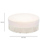 Tassy Tasseled Round Ottoman in tan velvet front view with textured hanging tassels