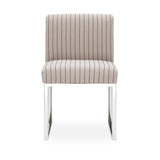 Pensel Dining Chair angled view highlighting curved sculptural backrest and silver metal legs