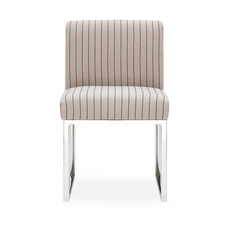 Pensel Dining Chair angled view highlighting curved sculptural backrest and silver metal legs