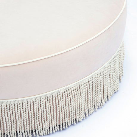 Top view of Tassy Round Ottoman showcasing circular silhouette and smooth velvet finish