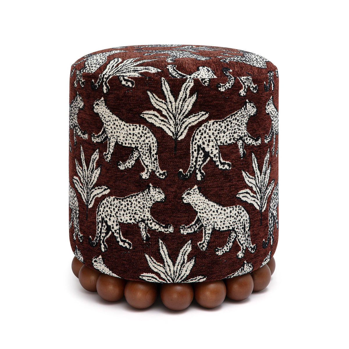 Dex round upholstered ottoman with wooden ball feet angled front view
