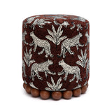 Dex round upholstered ottoman with wooden ball feet angled front view