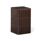 Forest green square accent table styled next to modern patio lounge chair