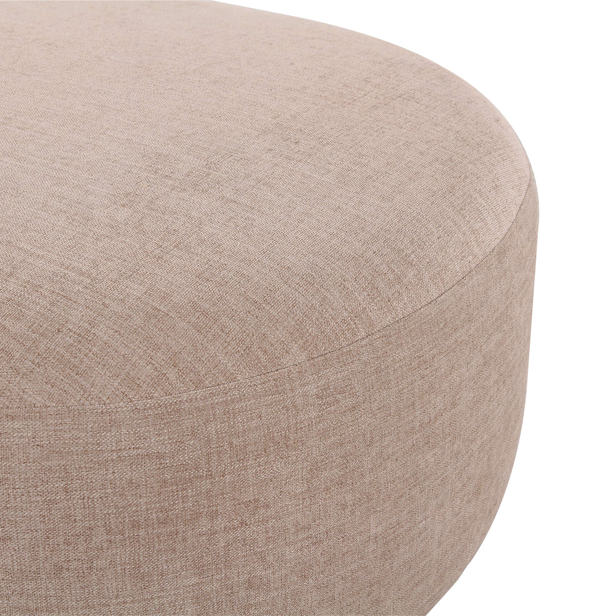 Neutral cream Gorge modular ottoman placed against an accent wall in a minimalist interior