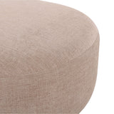 Neutral cream Gorge modular ottoman placed against an accent wall in a minimalist interior