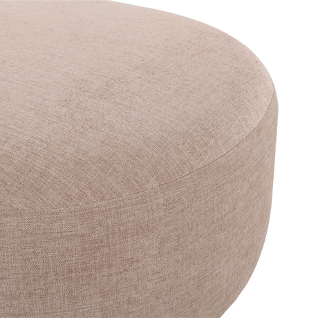 Neutral cream Gorge modular ottoman placed against an accent wall in a minimalist interior