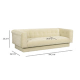 Detailed view of tailored track arms and dense foam seating on Jules velvet couch