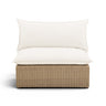 Cali outdoor armless chair in brown wicker with cream performance fabric cushions front view