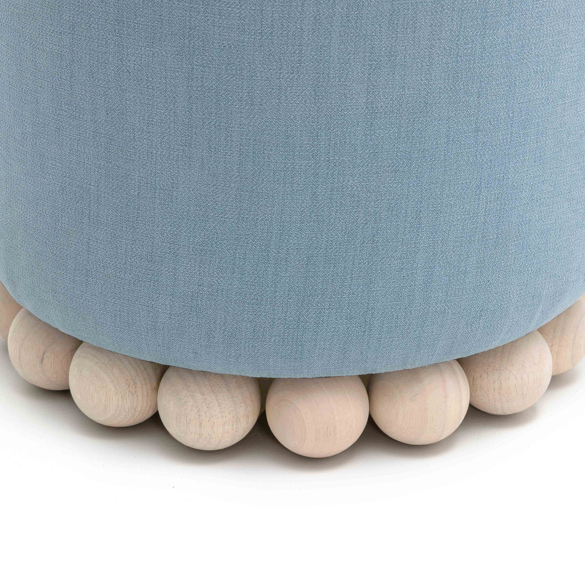 Dex round accent stool next to coffee table setup