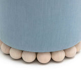 Dex round accent stool next to coffee table setup