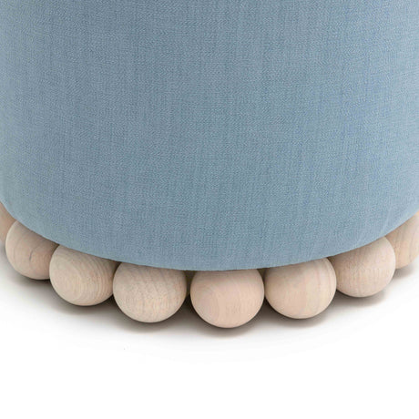 Dex round accent stool next to coffee table setup