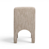 Low-angle view of sculpted arched legs on the Tomlin performance chair