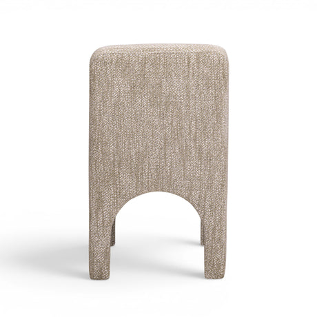 Low-angle view of sculpted arched legs on the Tomlin performance chair