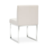 Three-quarter view of the Pensel Dining Chair showcasing the sleek open-frame silhouette