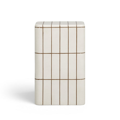 Ecru concrete side table used as bedside table in contemporary bedroom