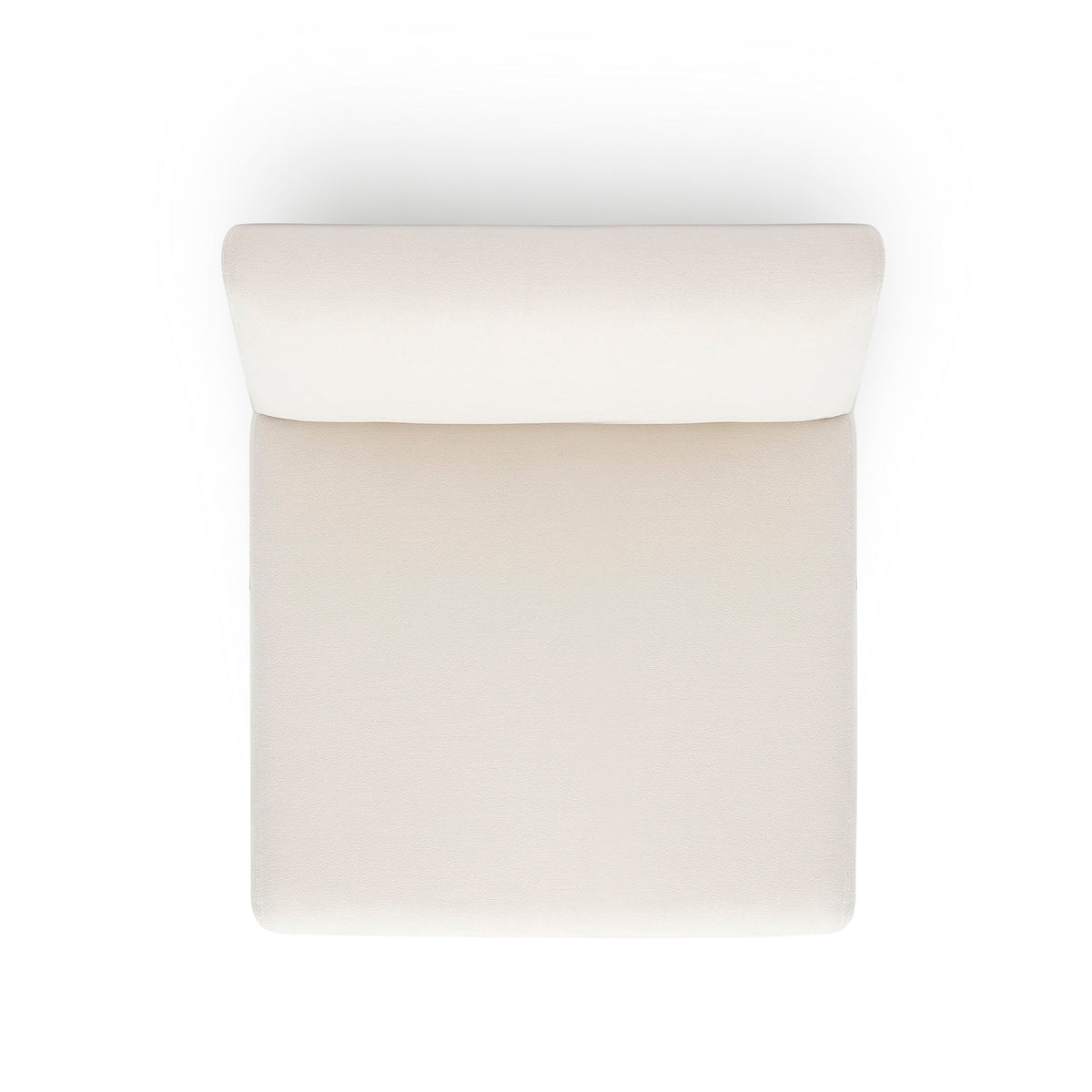 Pensel Dining Chair in Off-White fabric placed under natural architectural interior lighting