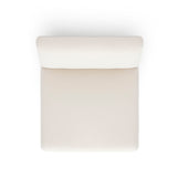 Pensel Dining Chair in Off-White fabric placed under natural architectural interior lighting