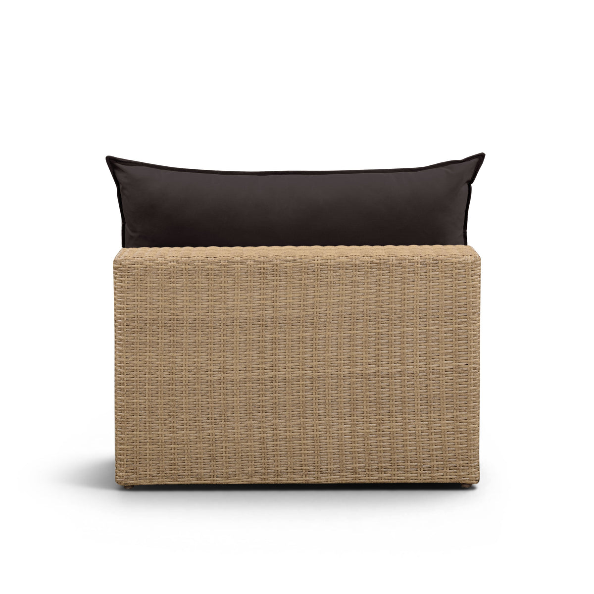 Side view of the natural wicker frame and cream outdoor seat cushion on the Cali chair